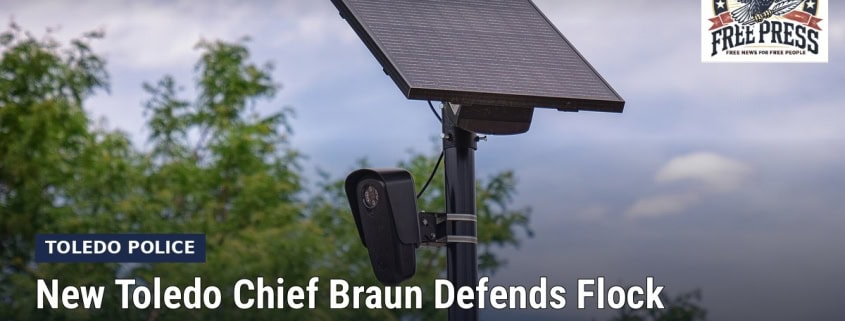 Fostoria News Toledo police camera and solar panel fence with Free Press logo.